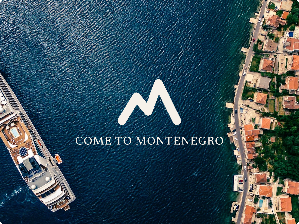 Come to Montenegro logo in white over an aerial photo of the sea, with a cruise ship on the left and an old town on the right